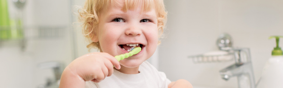 Young Kid Brushing Teeth - Children's Dentist Dr. Robert Ellis, III